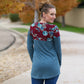 Back view of a tunic-length Nicolette featuring a crew neck, color blocking, and long sleeves. 