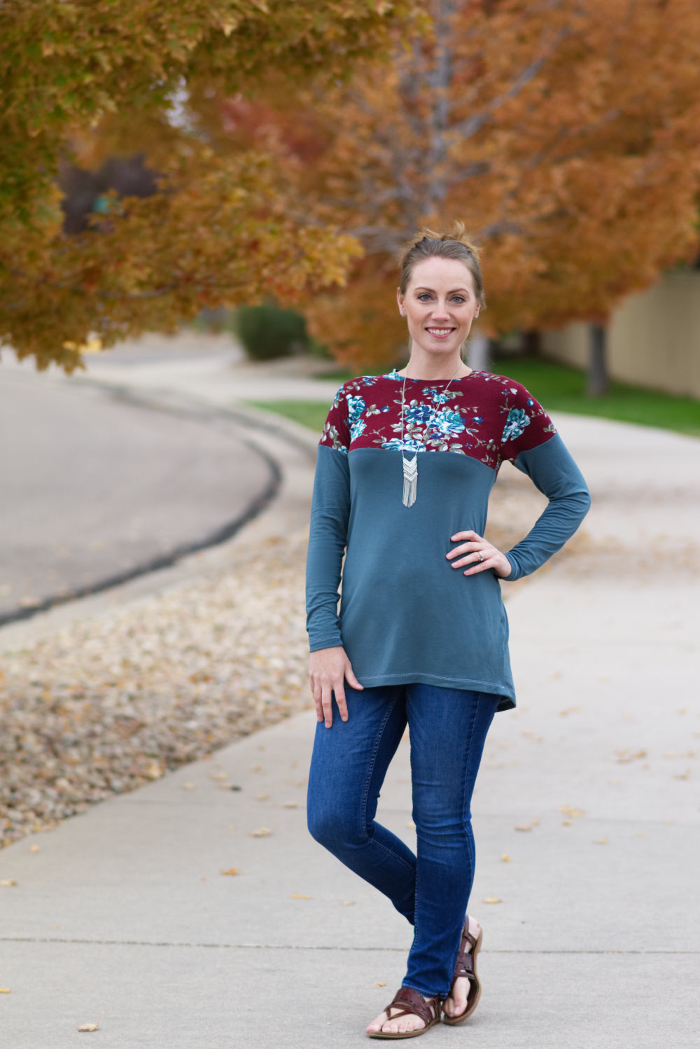 A tunic-length Nicolette featuring a crew neck, color blocking, and long sleeves. 
