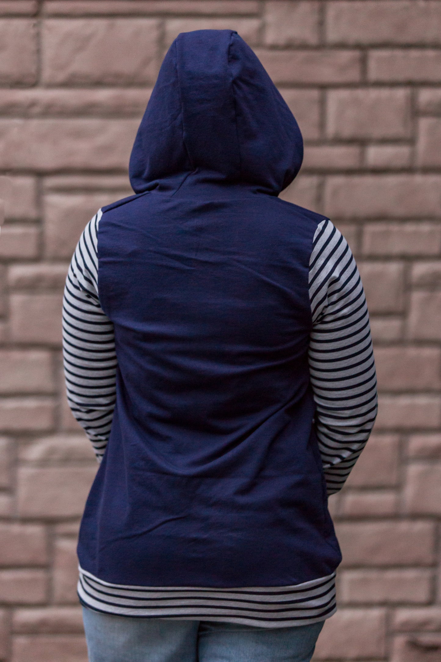 The Babe Hoodie with long sleeves and hood. Striped sleeves and hem. 