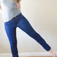 Woman standing with one leg straight out to the side wearing the DIBY Club Bootleg jeans.