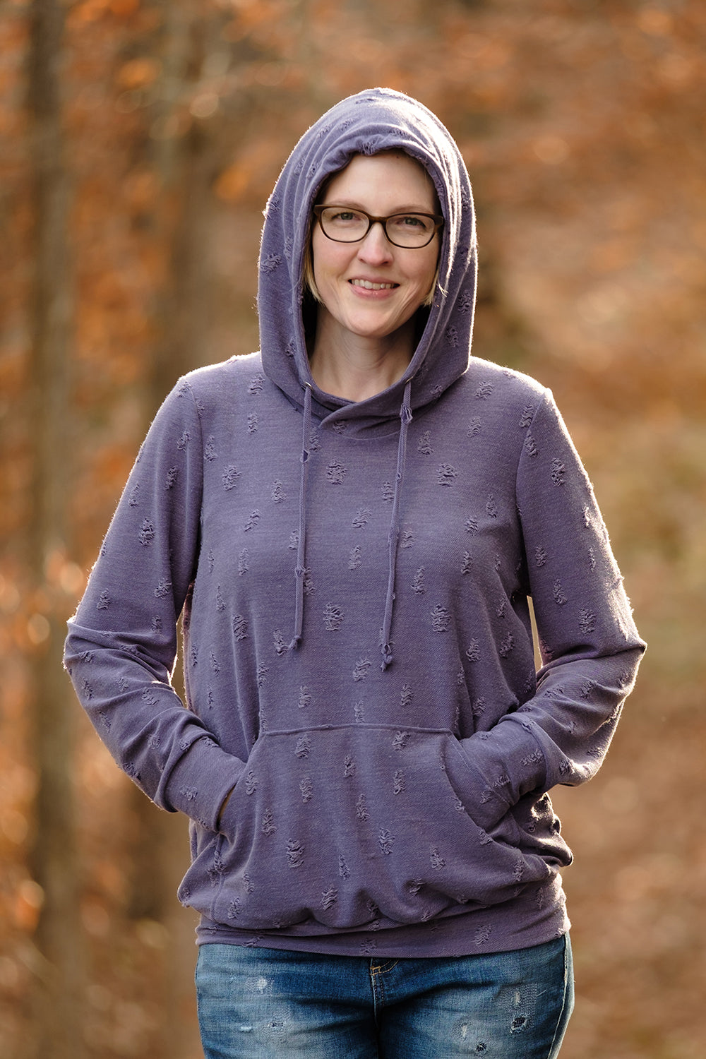 The Melissa Sweatshirt in misses size. Features a hood, kangaroo pocket, and banded hem. 