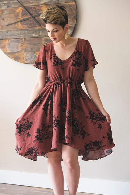 Sojourner Bias Dress with scoop neck and mid-thigh high-low hem. 