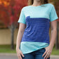 Close up of the Nicolette colorblocked t-shirt. Features a crew neck, three color-blocked panels, short sleeves, a breast pocket, and t-shirt length pattern options. 