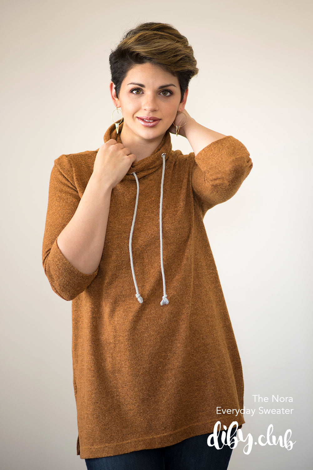 The Nora sweater with 3/4 length sleeves, drawstring funnel neck, and split hem. Misses size. 
