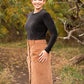 Photo of woman standing on a trail wearing a black long sleeve velvety shirt with a brown corduroy maxi-lengthDIBY Club Anna Button-Up Skirt