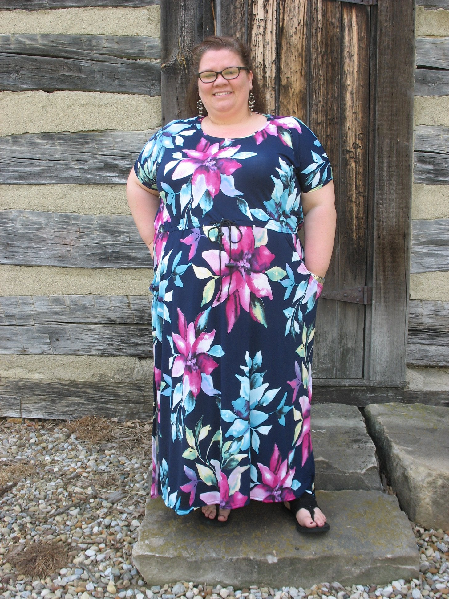 The Helen Dress in plus size. Features a solid front and maxi-length skirt. 