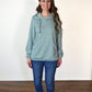 The Melissa Sweatshirt in misses size. Features a hood, kangaroo pocket, and elastic hem. 