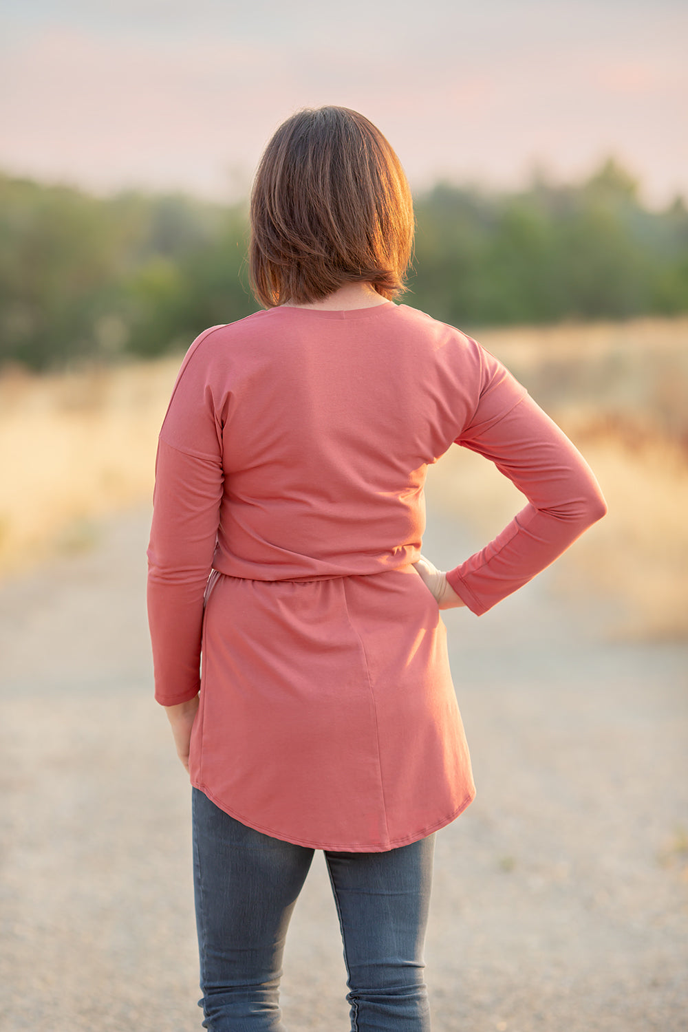 Back view of the Rosa in misses. Features long sleeves and shirt-length options. 