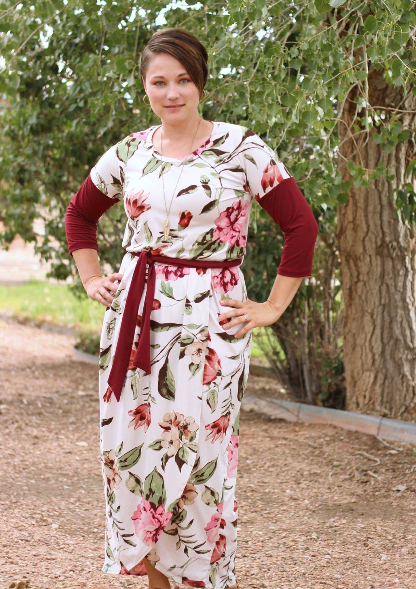 The Rosa in misses size. Features a scoop neck, long sleeves, and maxi-length skirt options. 