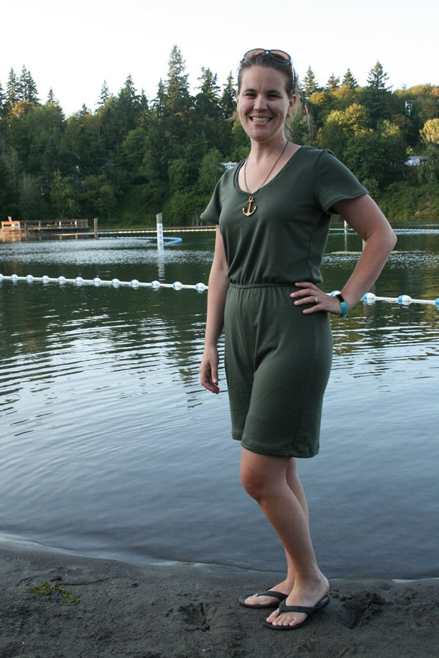 Stevie jumpsuit in an olive green color with short sleeves and shorts pattern options. Misses size. 