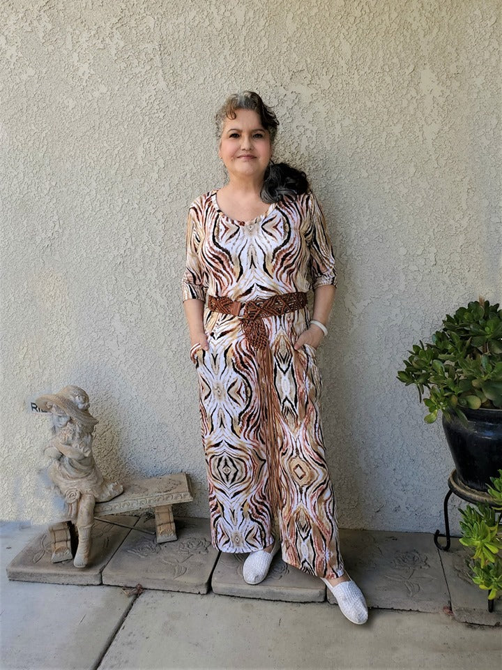 Stevie jumpsuit in misses size in a colorful pattern. Features include elbow sleeves and wide leg pattern options. 